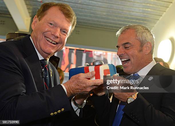 Captain Tom Watson and European Captain Paul McGinley share a Ryder Cup themed cake during the launch of a Ryder Cup Educational Resource at The...