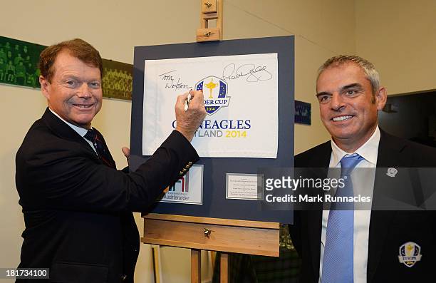 Captain Tom Watson and European Captain Paul McGinley signs a pin flag they have both signed during the launch of a Ryder Cup Educational Resource at...