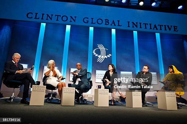 Former U.S. President Bill Clinton, moderates a panel discussion with Christine Lagarde, managing director of International Monetary Fund, Mo...
