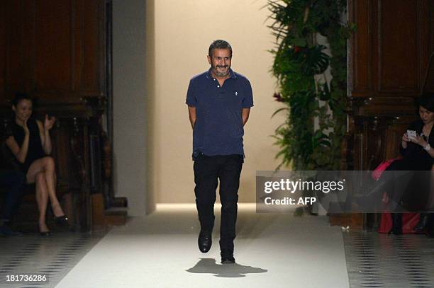 French designer Pascal Millet acknowledges the audience at the end of his 2014 Spring/Summer ready-to-wear collection fashion show, on September 24,...