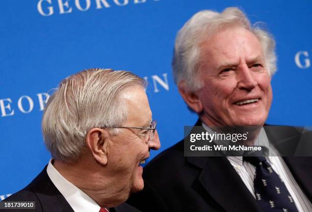 Former U.S. Vice President Walter Mondale and former Sen. Gary Hart confer at a Georgetown University Law Center discussion September 24, 2013 in...