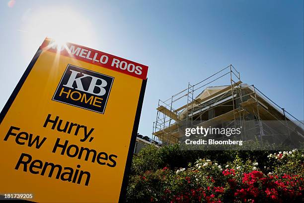 Home sign stands in front of a house under construction at the Whisler Ridge housing community in Lake Forest, California, U.S., on Monday, Sept. 23,...