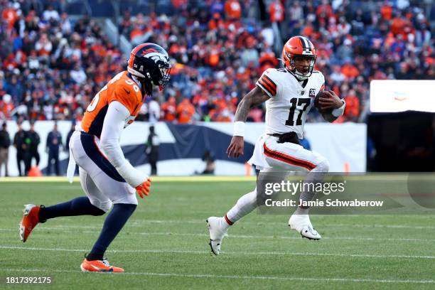 Dorian Thompson-Robinson of the Cleveland Browns rushes against Baron Browning of the Denver Broncos at Empower Field At Mile High on November 26,...