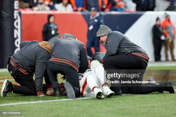 Dorian Thompson-Robinson of the Cleveland Browns is pressured by Baron Browning of the Denver Broncos at Empower Field At Mile High on November 26,...