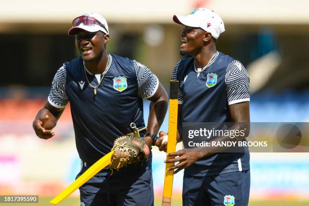 Daren Sammy and Alzarri Joseph of West Indies take part in a training session one day ahead of the 1st ODI between West Indies and England at Vivian...