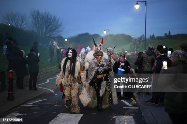 Participants dressed as "Krampus", a half-goat, half-demon figure that punishes people who misbehave during the Christmas season, take part in "The...