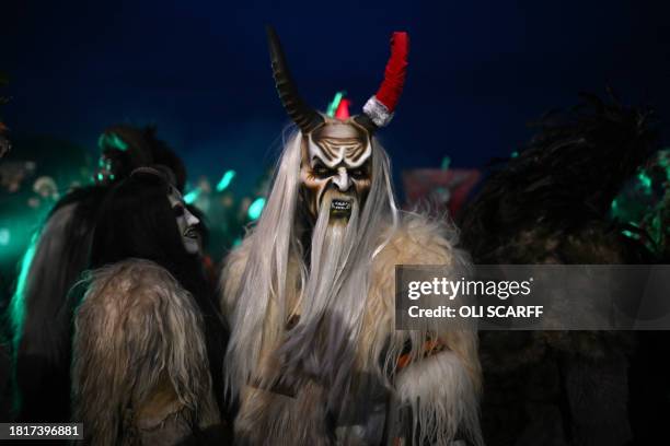 Participants dressed as "Krampus", a half-goat, half-demon figure that punishes people who misbehave during the Christmas season, take part in "The...