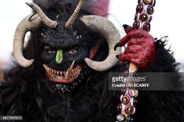 Participant dressed as "Krampus", a half-goat, half-demon figure that punishes people who misbehave during the Christmas season, takes part in "The...