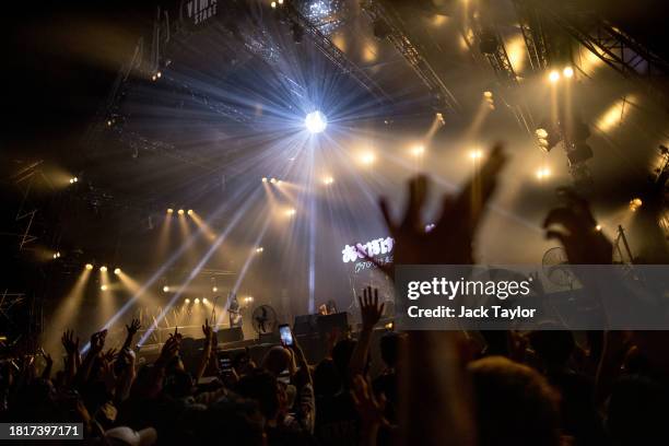 Festival-goers watch Japanese punk rock band Otoboke Beaver perform at Maho Rasop Festival 2023 on December 2, 2023 in Bangkok, Thailand.