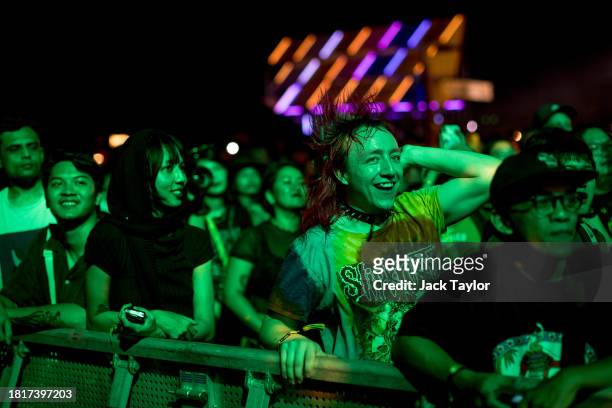 Festival-goers watch Japanese punk rock band Otoboke Beaver perform at Maho Rasop Festival 2023 on December 2, 2023 in Bangkok, Thailand.