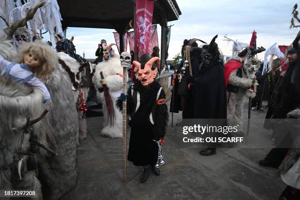 Participants dressed as "Krampus", a half-goat, half-demon figure that punishes people who misbehave during the Christmas season, take part in "The...