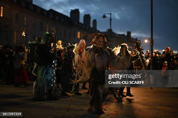 Participants dressed as "Krampus", a half-goat, half-demon figure that punishes people who misbehave during the Christmas season, take part in "The...