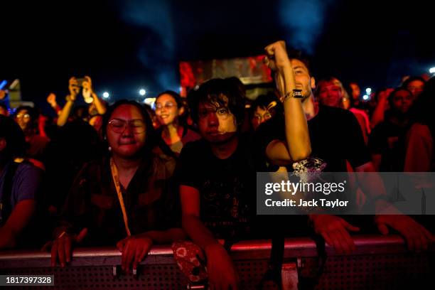 Festival-goers watch Japanese punk rock band Otoboke Beaver perform at Maho Rasop Festival 2023 on December 2, 2023 in Bangkok, Thailand.