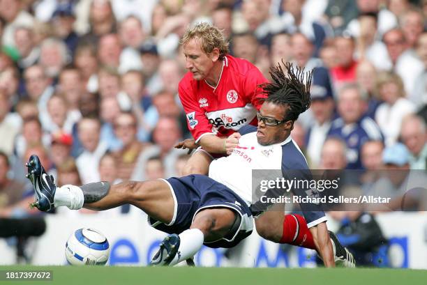 August 20: Edgar Davids of Tottenham Hotspur and Ray Parlour of Middlesbrough FC challenge during the Premier League match between Tottenham Hotspur...