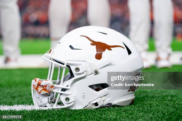 Texas Longhorns helmet sits on the sidelines during the Big 12 Championship game between the Texas Longhorns and the Oklahoma State Cowboys on...