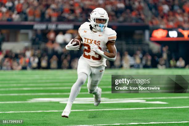 Texas Longhorns running back Jaydon Blue runs during the Big 12 Championship game between the Texas Longhorns and the Oklahoma State Cowboys on...