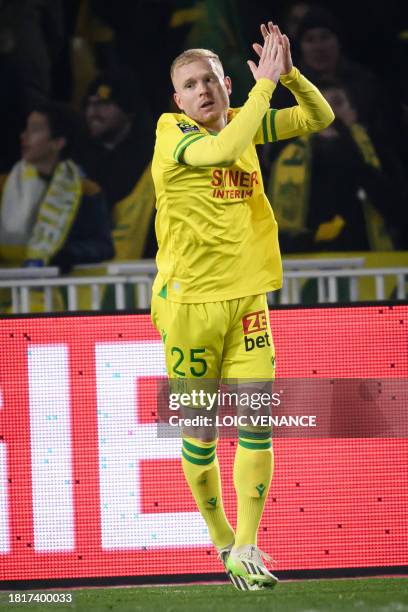 Nantes' French midfielder Florent Mollet celebrates after scoring a goal during the French L1 football match between FC Nantes and OGC Nice at La...