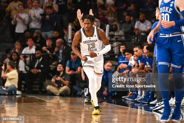 Georgia Tech guard Miles Kelly reacts after making a three-pointer during the college basketball game between the Duke Blue Devils and the Georgia...