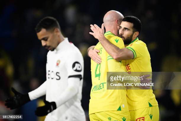 Nantes' players celebrate their victory at the end of the French L1 football match between FC Nantes and OGC Nice at La Beaujoire stadium in Nantes,...
