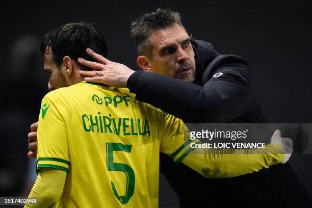 Nantes' French head coach Jocelyn Gourvennec congratulates Nantes' Spanish midfielder and captain Pedro Chirivella during the French L1 football...