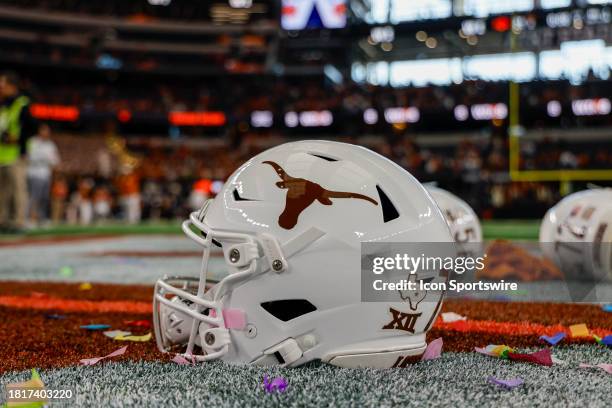 Texas Longhorns helmet sits on the turf after the Big 12 Championship game between the Texas Longhorns and the Oklahoma State Cowboys on December 2,...