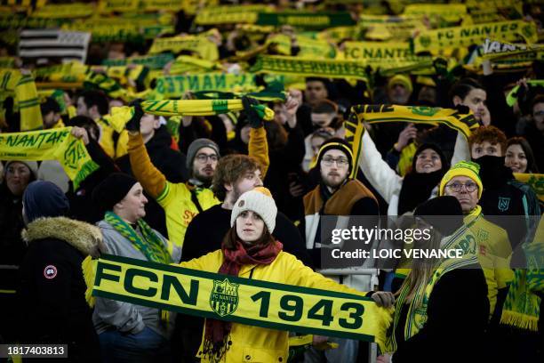 Nantes' supporters cheer their team during the French L1 football match between FC Nantes and OGC Nice at La Beaujoire stadium in Nantes, western...