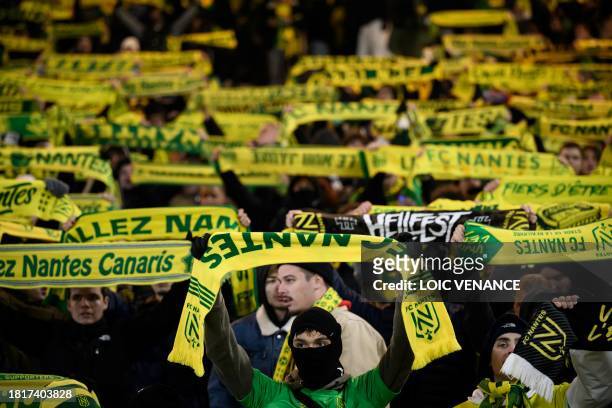 Nantes' supporters cheer their team during the French L1 football match between FC Nantes and OGC Nice at La Beaujoire stadium in Nantes, western...