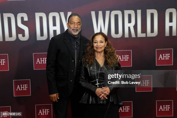 Award winning director/choreographer, Debbie Allen poses with her husband, basketball legend, Norm Nixon on the red carpet at the World AIDS Day...