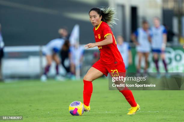 China PR midfielder Tang Jiali controls the ball during an international friendly soccer match between the U.S. Women's National Team and China PR at...