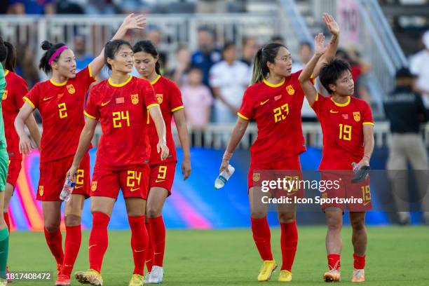 China PR defender Li Mengwen , China PR midfielder Tang Jiali and China PR forward Zhang Linyan wave to fans along with China PR forward Jin Kun...