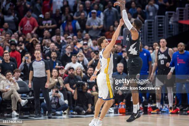 Golden State Warriors guard Klay Thompson defends Los Angeles Clippers forward Paul George making the game-winning shot in the second half of an NBA...