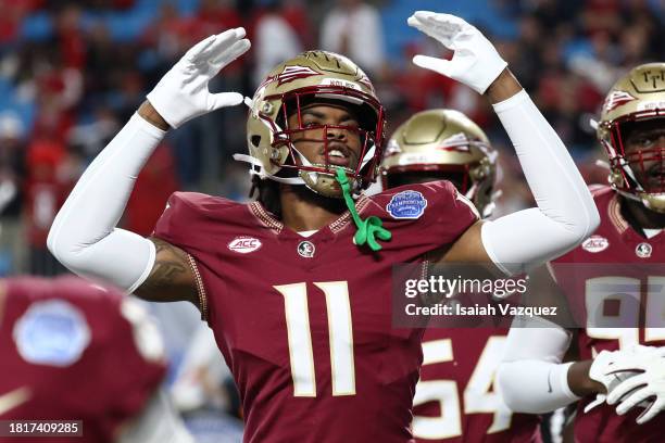 Patrick Payton of the Florida State Seminoles cheers on the crowd before taking on the Louisville Cardinals during the ACC Championship at Bank of...