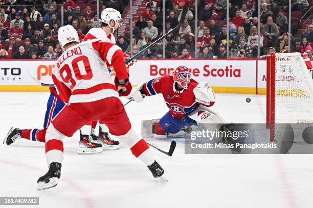 Joe Veleno of the Detroit Red Wings shoots the puck past goaltender Jake Allen of the Montreal Canadiens during the first period at the Bell Centre...