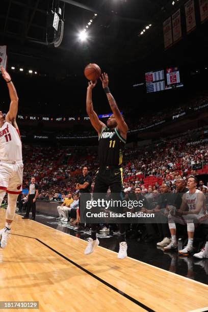 Bruce Brown of the Indiana Pacers shoots a three point basket during the game against the Miami Heat on December 2, 2023 at Kaseya Center in Miami,...