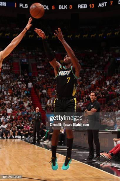 Buddy Heild of the Indiana Pacers shoots a three point basket during the game against the Miami Heat on December 2, 2023 at Kaseya Center in Miami,...