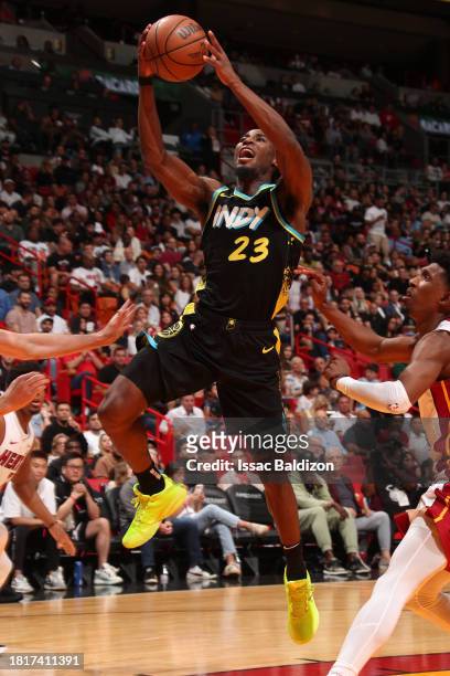 Aaron Nesmith of the Indiana Pacers drives to the basket during the game against the Miami Heat on December 2, 2023 at Kaseya Center in Miami,...