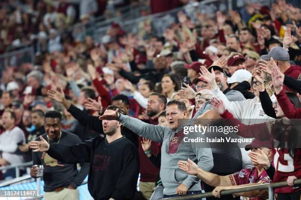 Fans of the Florida State Seminoles perform "The Seminole Chop" during the football game between the Florida State Seminoles and the Louisville...