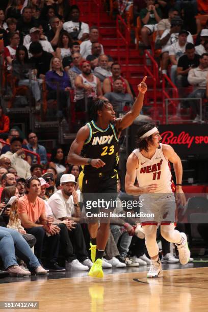 Aaron Nesmith of the Indiana Pacers celebrates a three point basket during the game against the Miami Heat on December 2, 2023 at Kaseya Center in...