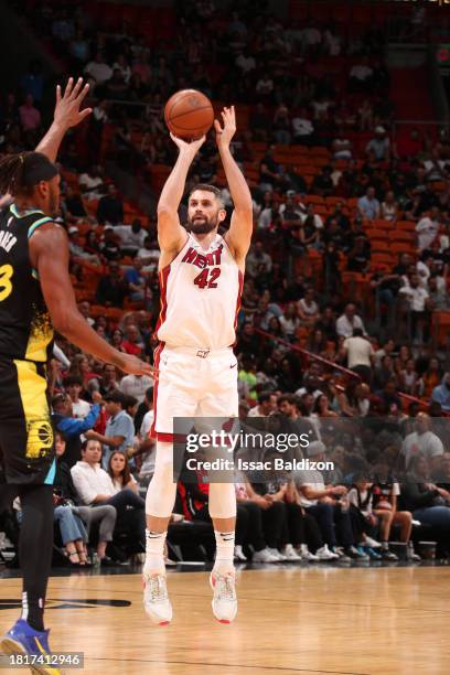 Kevin Love of the Miami Heat shoots a three point basket during the game against the Indiana Pacers on December 2, 2023 at Kaseya Center in Miami,...
