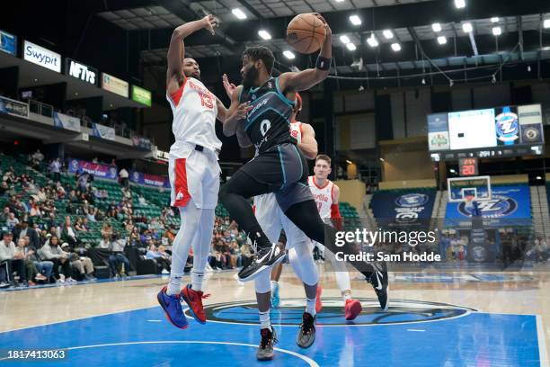 December 02: Mike Miles Jr. #0 of the Texas Legends looks to pass under the basket during the third quarter against the Memphis Hustle on December 2,...