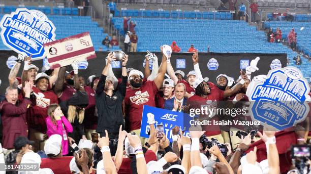 The Florida State Seminoles celebrate after defeating the Louisville Cardinals in the ACC Championship at Bank of America Stadium on December 2, 2023...