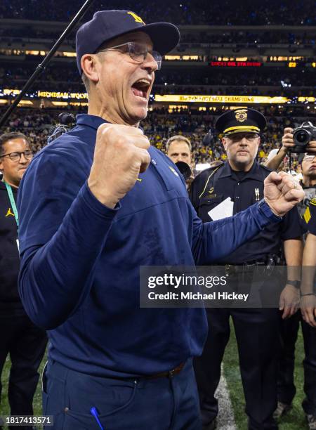Head coach Jim Harbaugh of the Michigan Wolverines celebrates after winning the Big Ten Championship against the Iowa Hawkeyes at Lucas Oil Stadium...