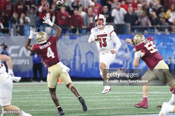 Florida State Seminoles linebacker Kalen DeLoach jumps up to bat down a pass thrown by Louisville Cardinals quarterback Jack Plummer during the ACC...