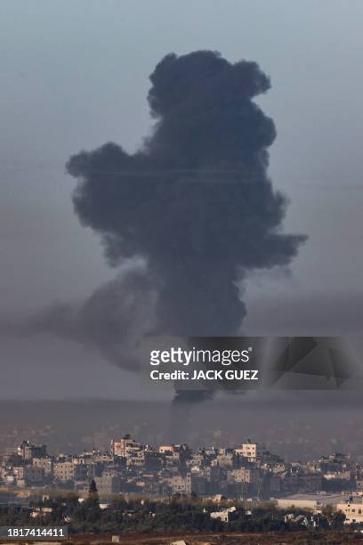 Picture taken from southern Israel near the border with the Gaza Strip on December 3 shows smoke billowing over the Palestinian enclave during...
