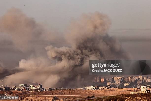 Picture taken from southern Israel near the border with the Gaza Strip on December 3 shows smoke billowing over the Palestinian enclave during...