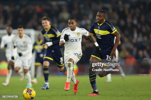 Crysencio Summerville of Leeds United is being fouled by Anfernee Dijksteel of Middlesbrough during the Sky Bet Championship match between Leeds...