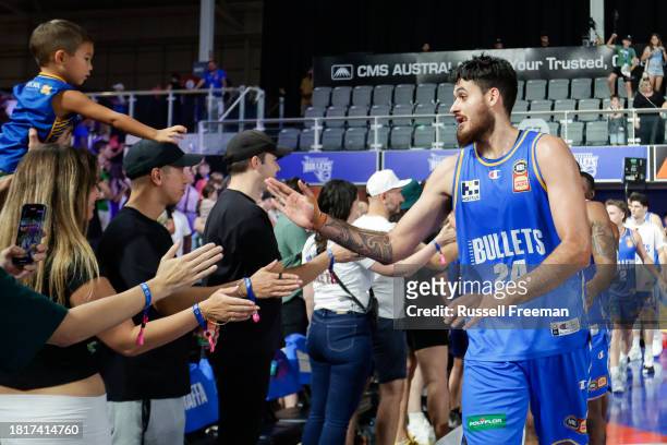 Tyrell Harrison of the Bullets interacts with fans after the round nine NBL match between Brisbane Bullets and Illawarra Hawks at Nissan Arena, on...