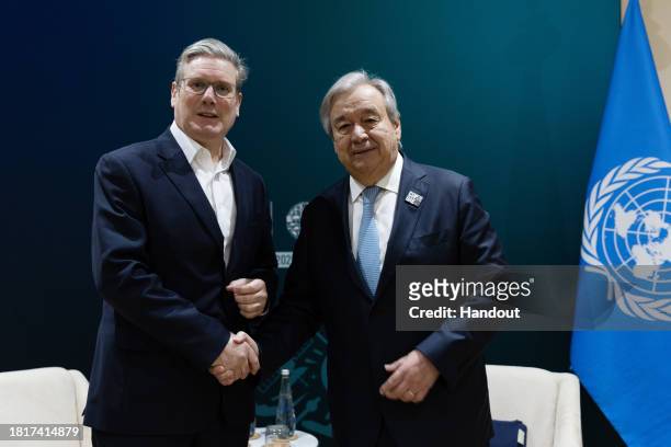 In this handout image suppled by COP28, Labour leader Sir Keir Starmer meets António Guterres, Secretary-General of the United Nations, day four of...