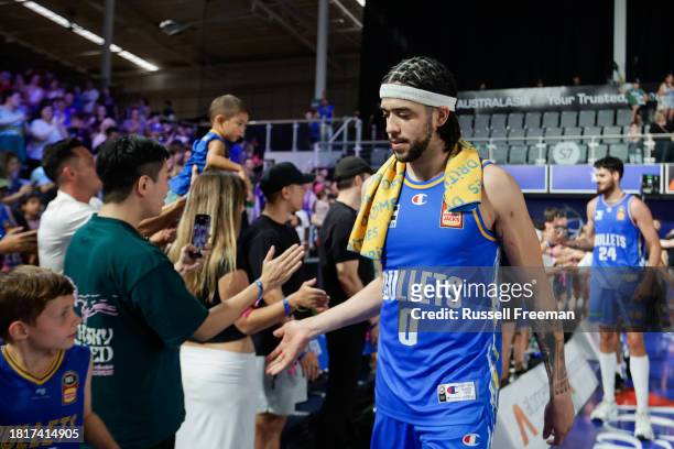Mitchell of the Bullets interacts with fans after the round nine NBL match between Brisbane Bullets and Illawarra Hawks at Nissan Arena, on December...