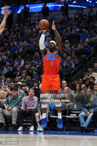 Luguentz Dort of the Oklahoma City Thunder shoots a three point basket during the game on December 2, 2023 at the American Airlines Center in Dallas,...